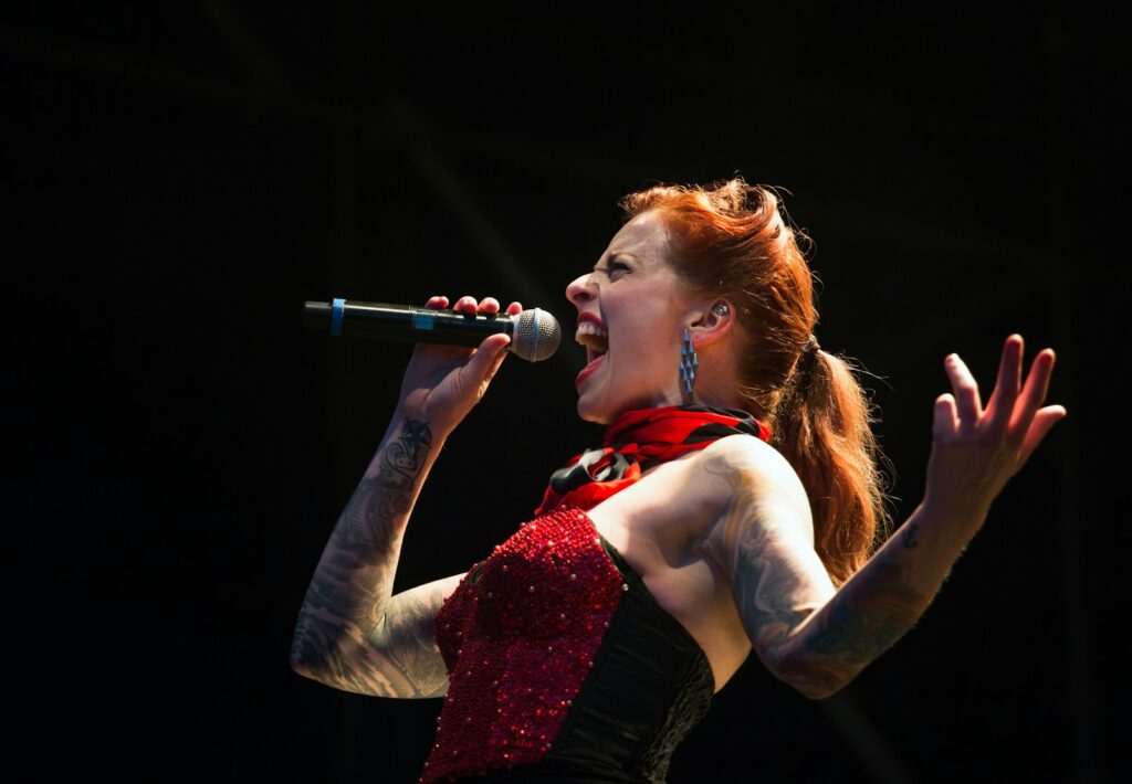 woman singing on wireless microphone