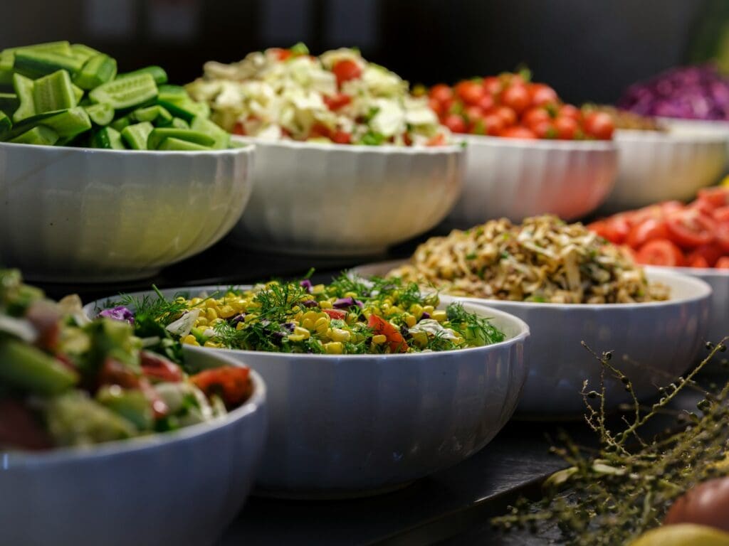 a group of bowls full of food