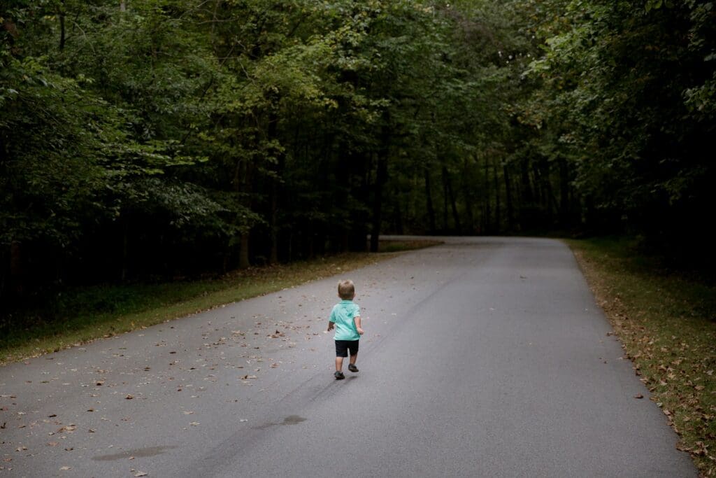 children sitting on road