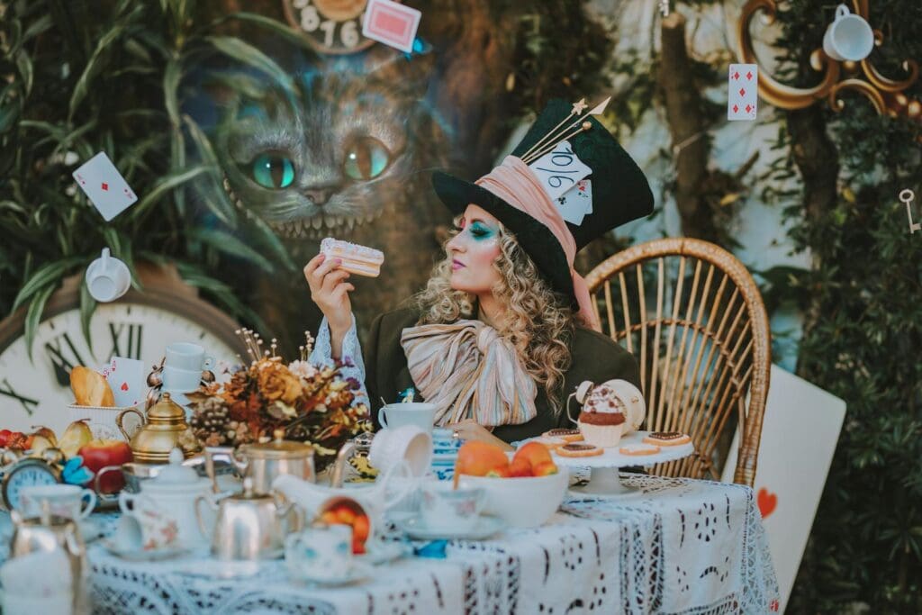 A whimsical Alice in Wonderland inspired scene with a Mad Hatter character at a tea party.