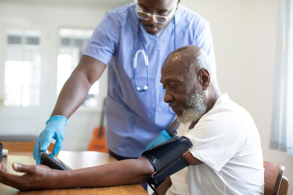 a doctor checking a patient's blood pressure