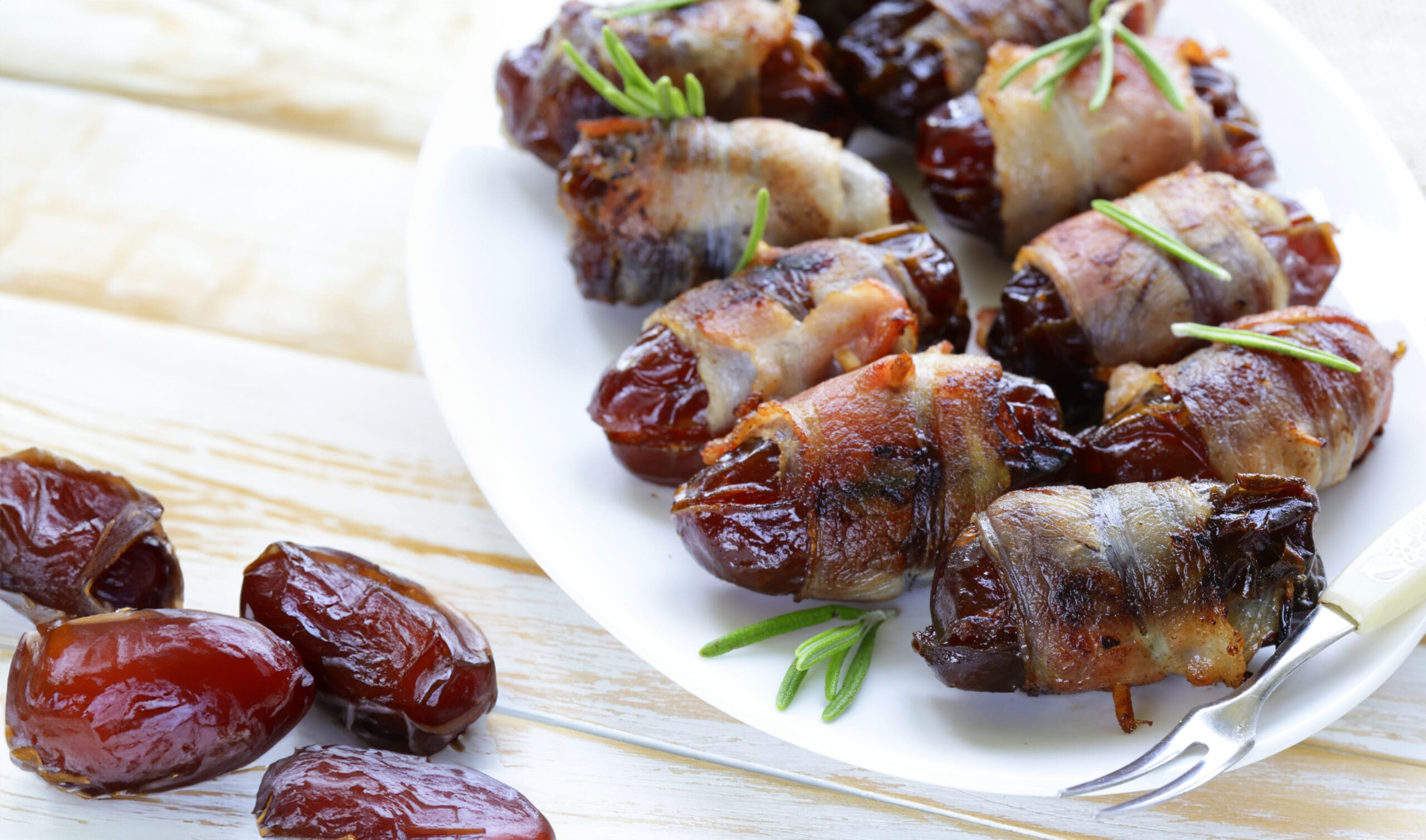 delicacy appetizer fried dates with bacon and rosemary