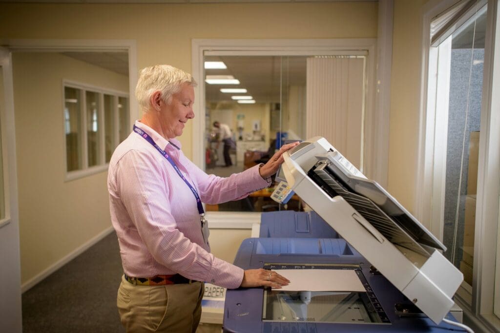 A man using a copying machine