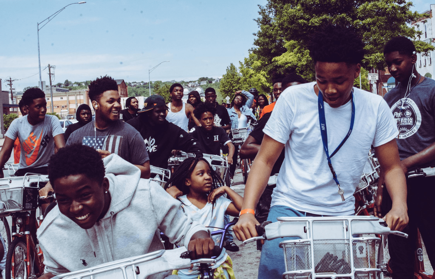 Group of children riding bicycles outdoors together