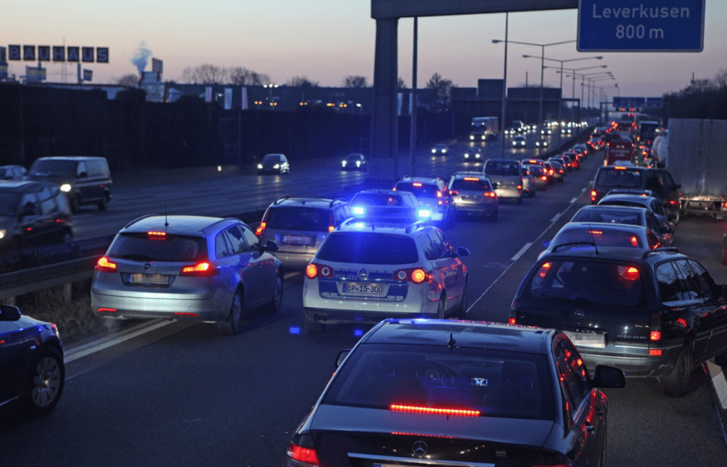 Evening traffic jam with police car present