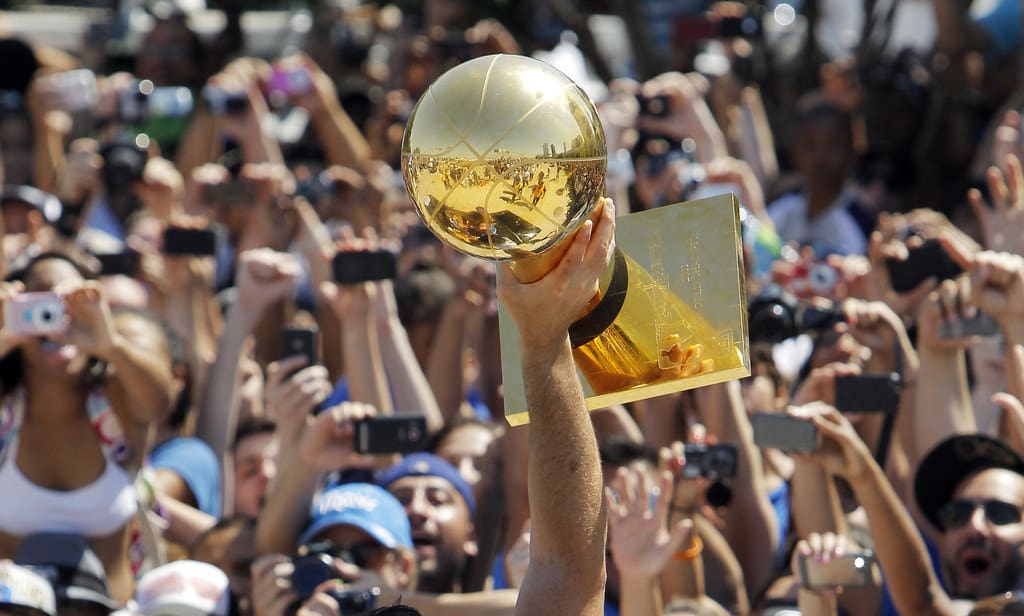 holding up championship trophy