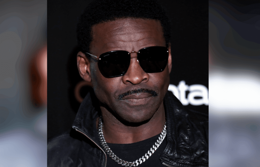 Michael Irvin wear a black Glasees