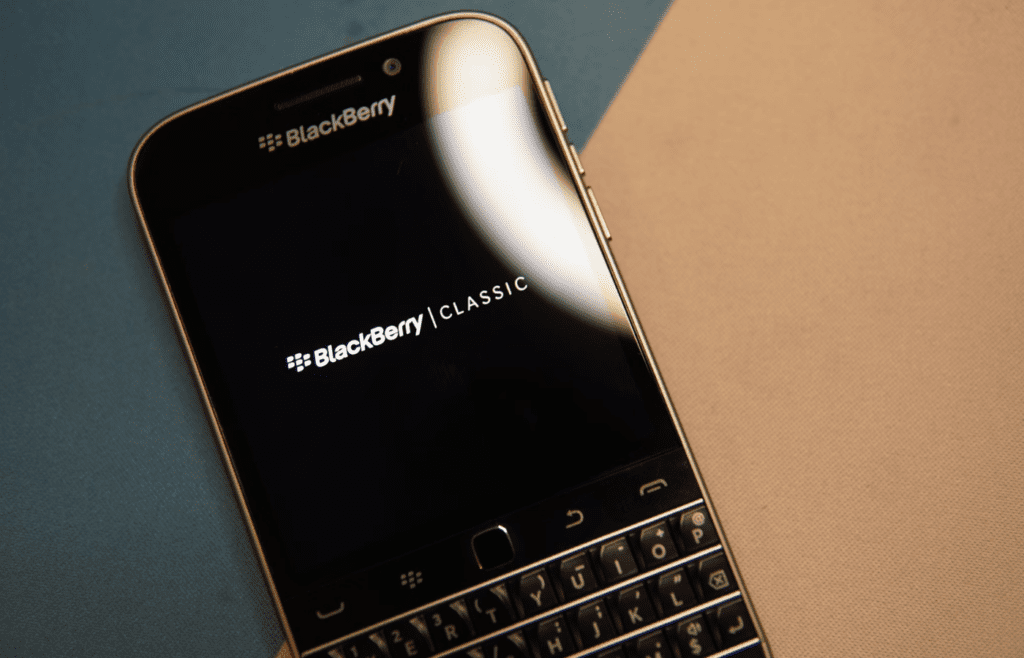 Black and silver blackberry qwerty phone