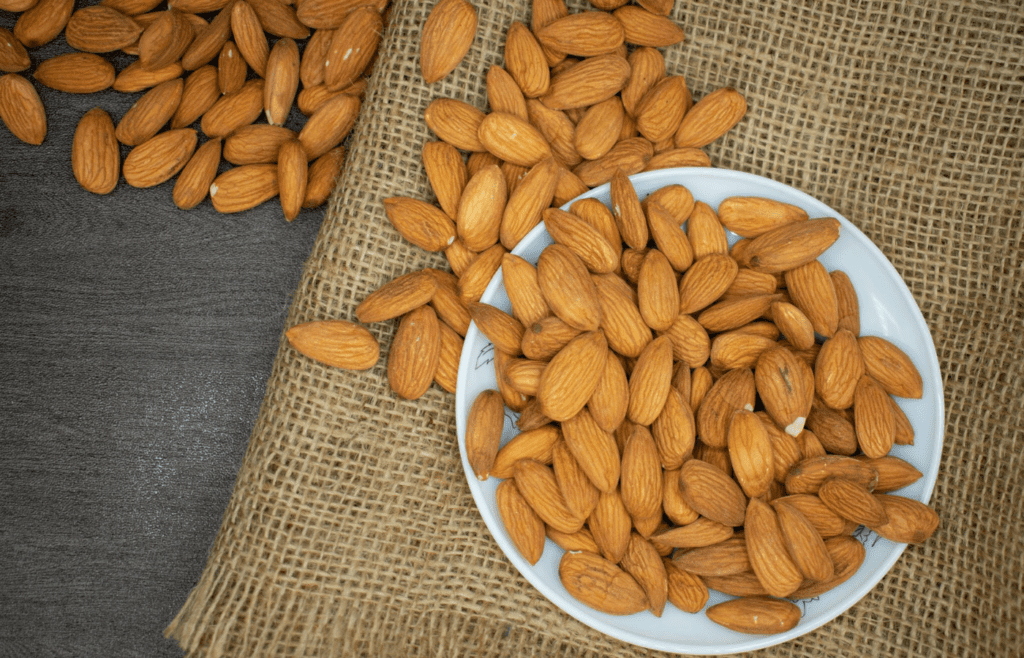 Brown Almond Nuts on White Plate