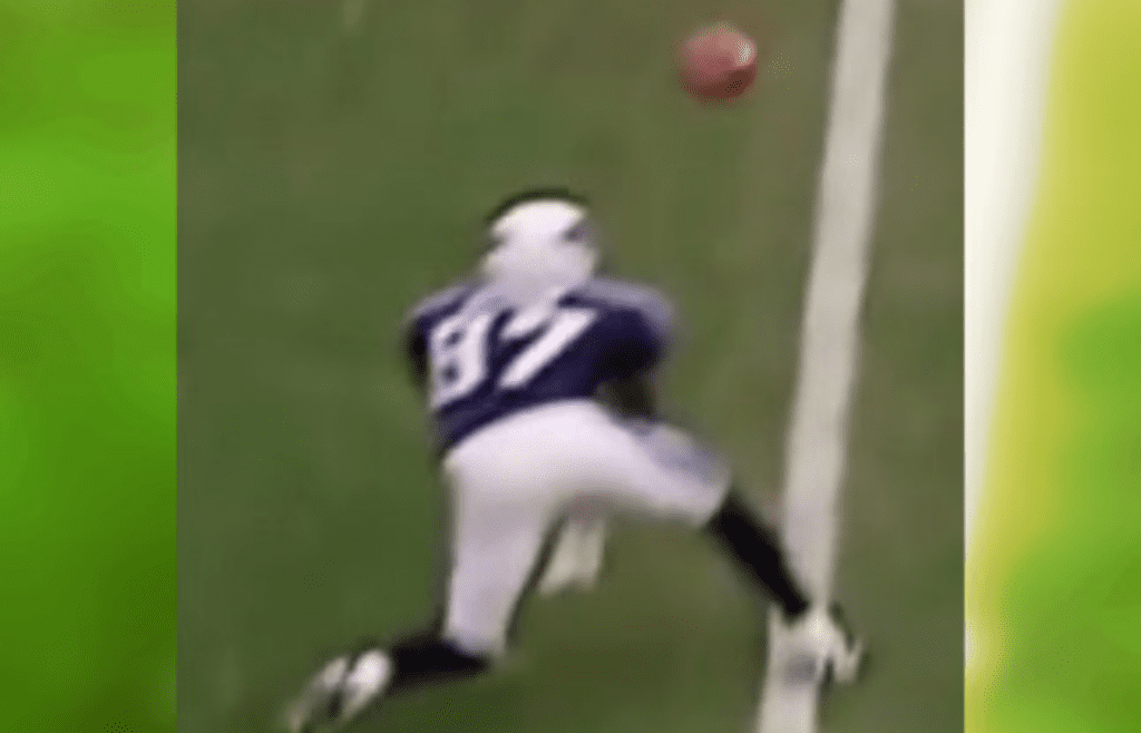 Kevin Dyson reaches for ball near sideline