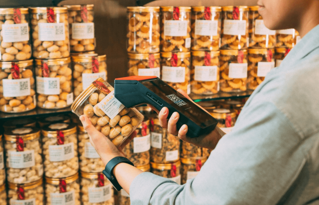 Person using Barcode scanner on Jar of Pickles
