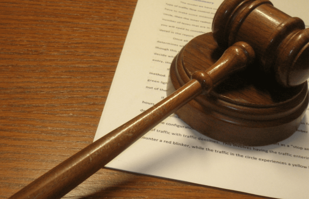 Gavel resting on financial report sheet