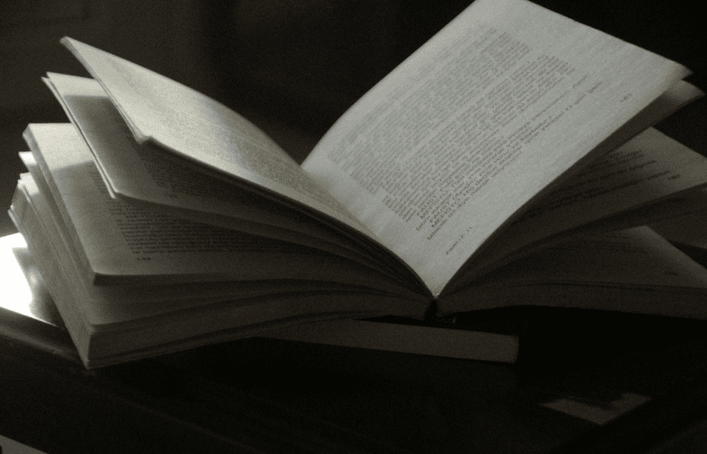 Pages of an open book turning smoothly