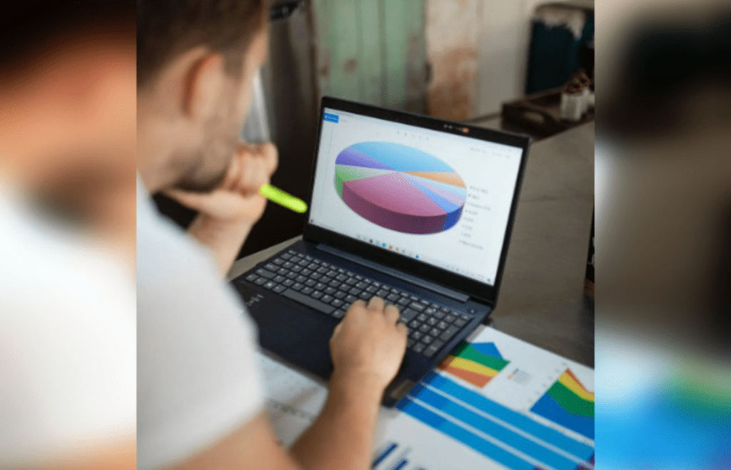 Man analyzing colorful pie chart of investments