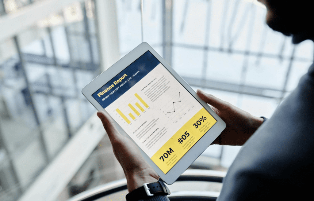 Person Holding a Tablet with Finance Report