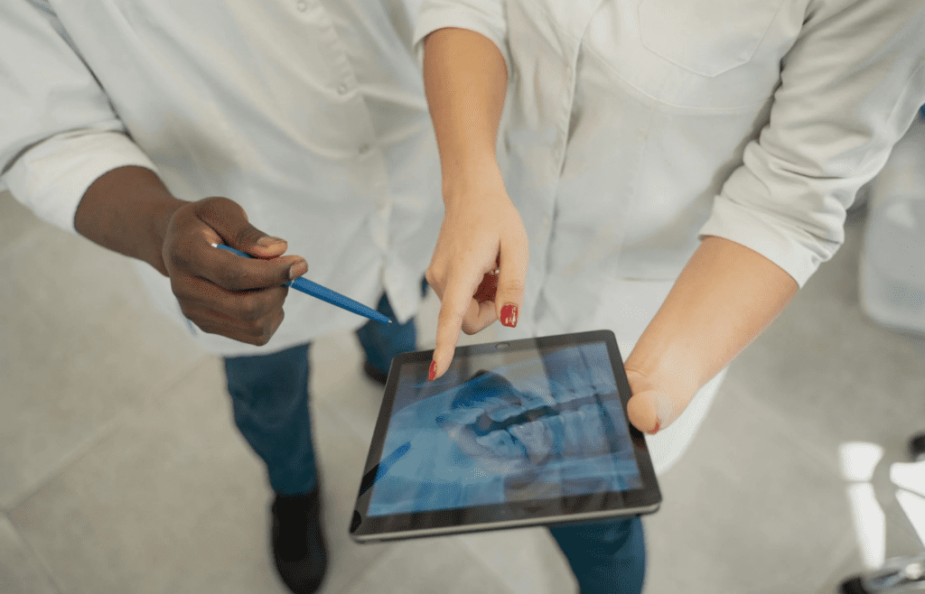 Tablet displaying AI medical scans to a doctor