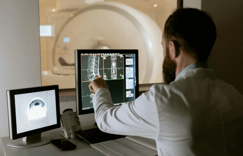 Radiologist analyzing spine MRI with AI support