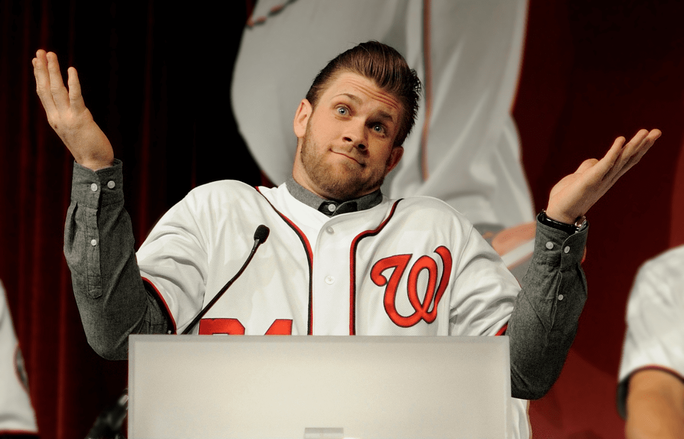Bryce Harper Baseball player shrugging at podium