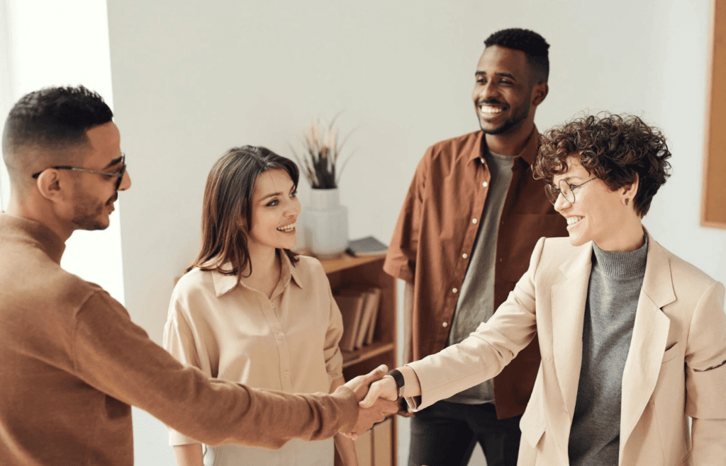 Office team exchanging praise with hidden digs
