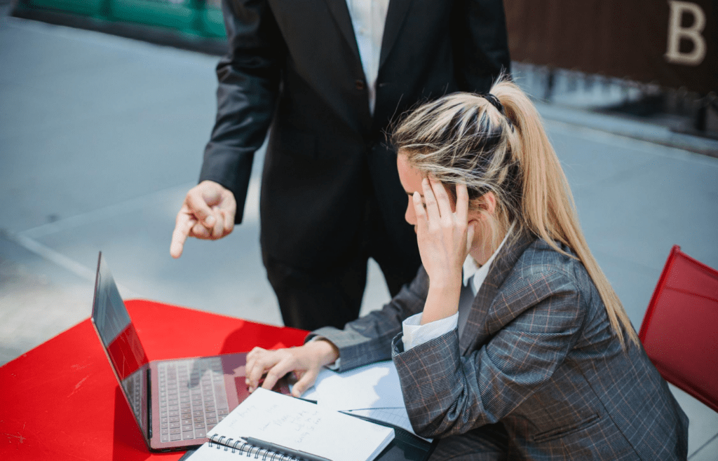 Confused worker under pressure from supervisor