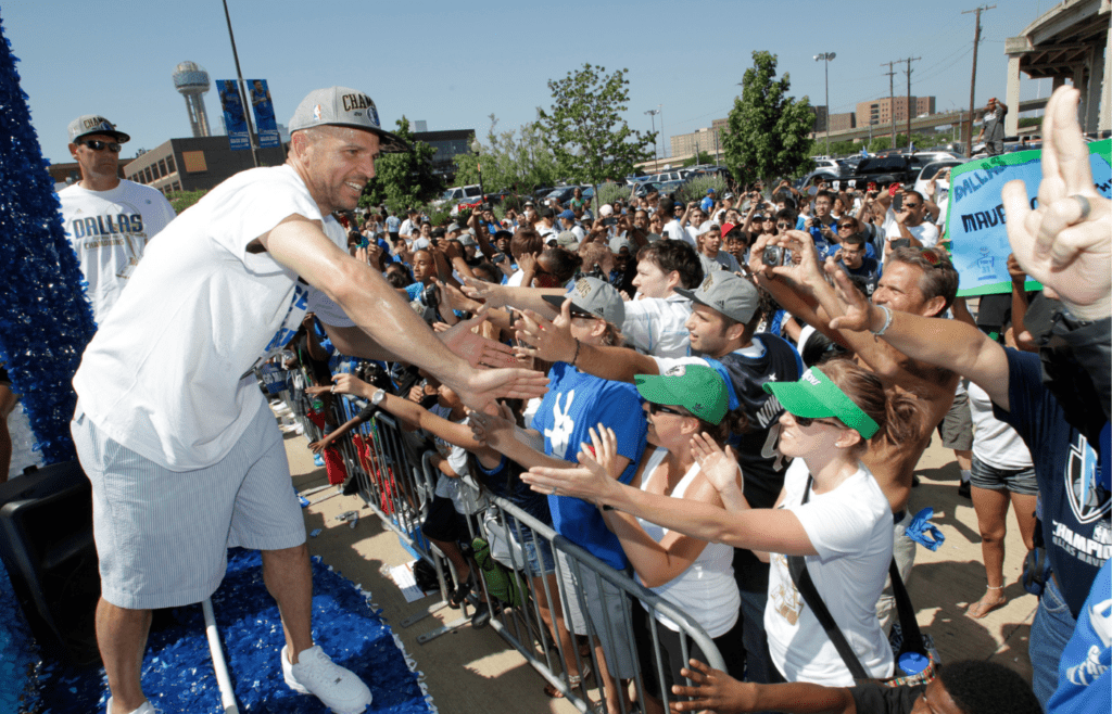 Dallas Mavericks players celebrate NBA title with fans