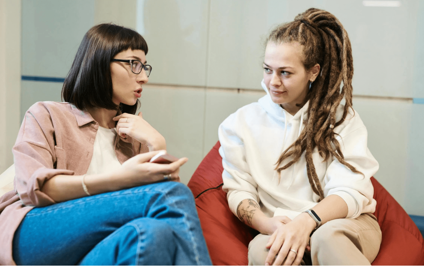 Woman oversharing personal details with coworker