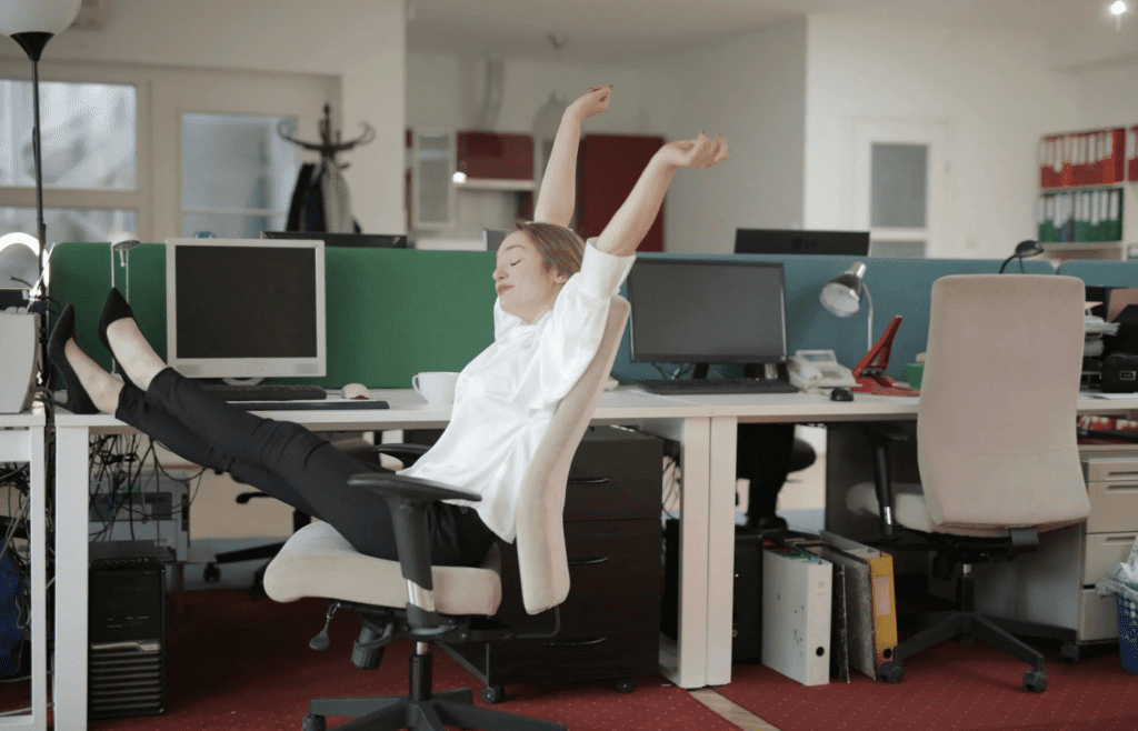 A person doing a quick stretch break at their desk