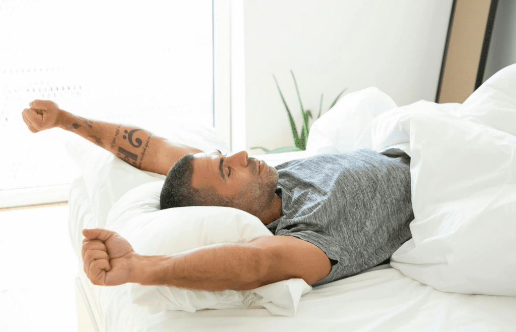 A person yawning or rubbing eyes after waking up