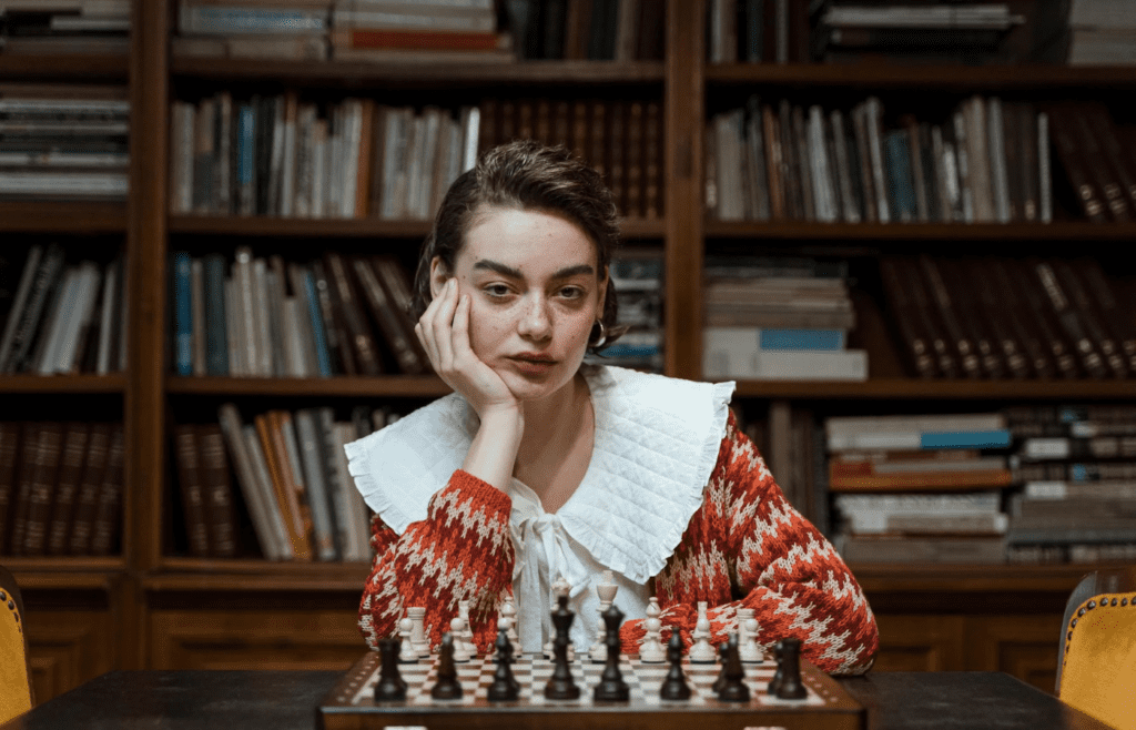 A person sitting blankly while ignoring a favorite hobby