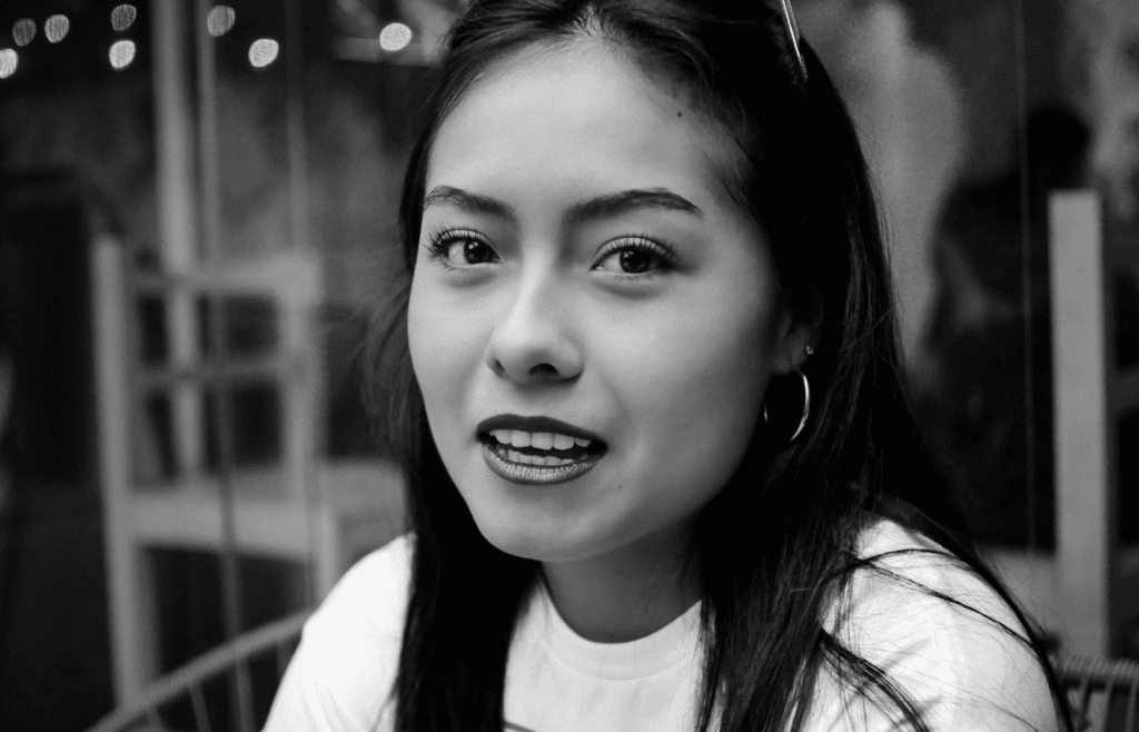 A person rolling their eyes or snapping during a conversation