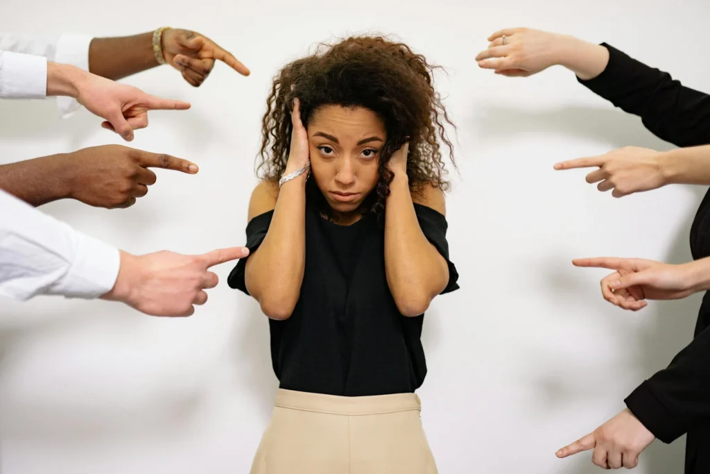 People Pointing Fingers at a Woman