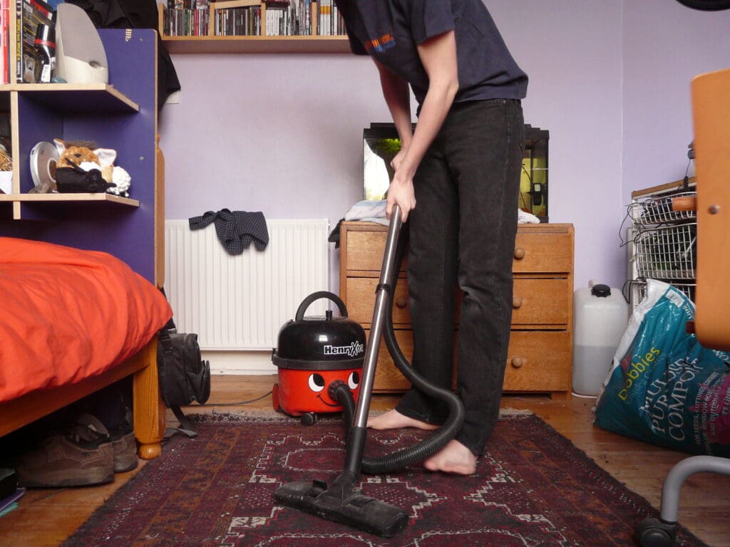 person cleaning up a room