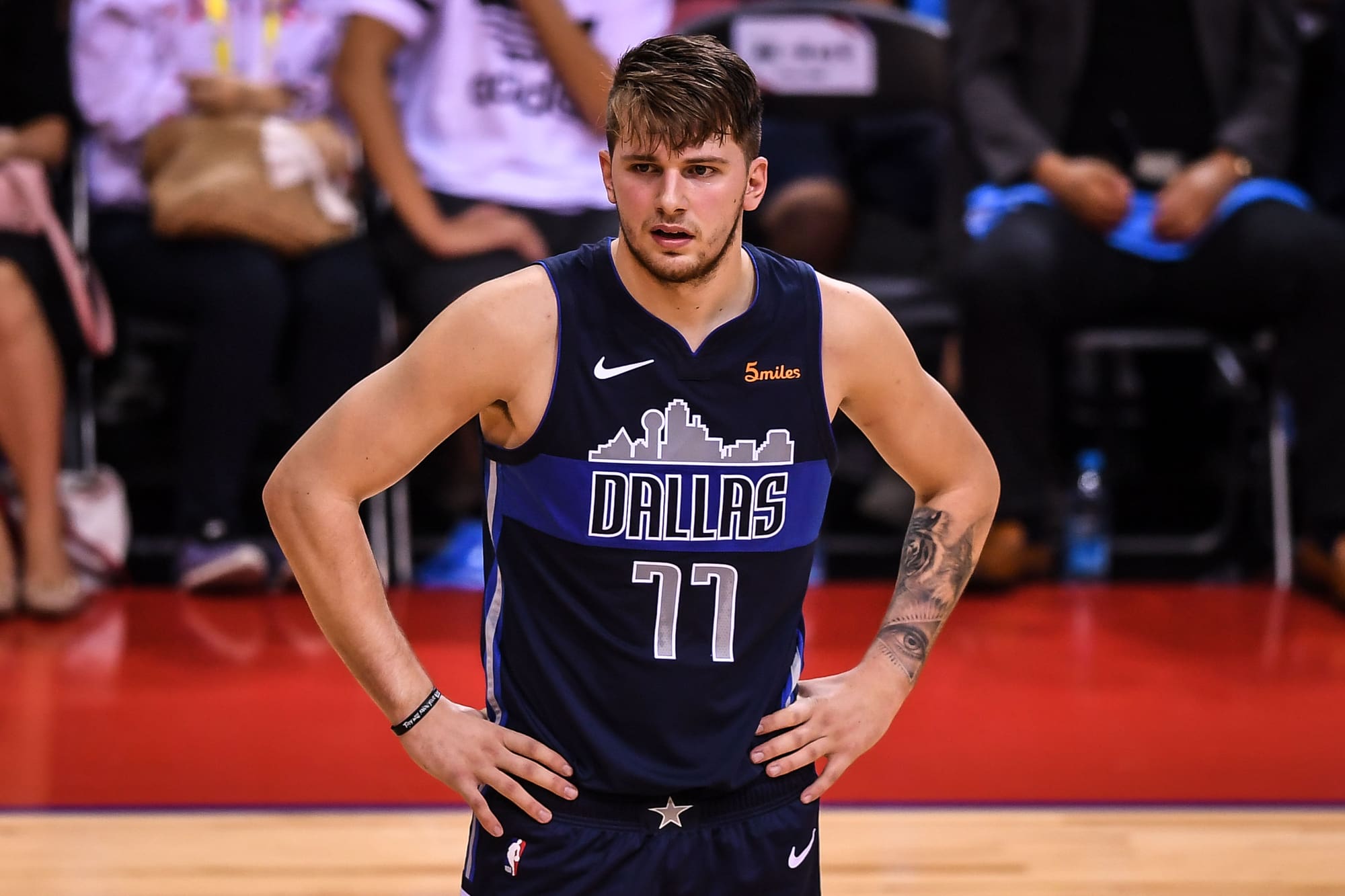 Luka Doncic of Dallas Mavericks reacts as they compete against Philadelphia 76ers during the Shenzhen match of the NBA China Games in Shenzhen city, south China's Guangdong province, 8 October 2018. Mavericks beat 76ers 115-112 at Shenzhen match of NBA China Games.