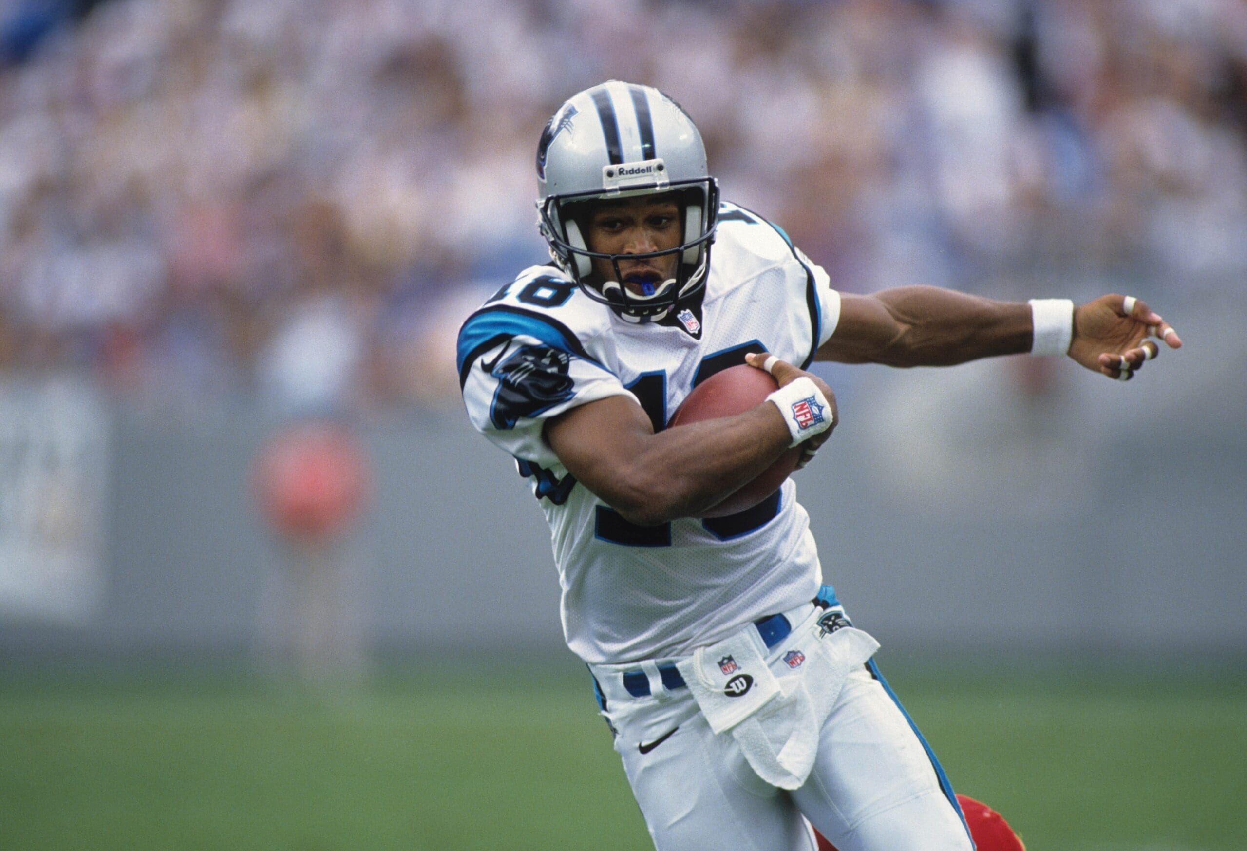 Sep 21, 1997; Charolette, NC, USA; FILE PHOTO; Carolina Panthers receiver Rae Carruth (83) carries the ball against the Kansas City Chiefs at Ericsson Stadium. Mandatory Credit: RVR Photos - USA TODAY Sports.
