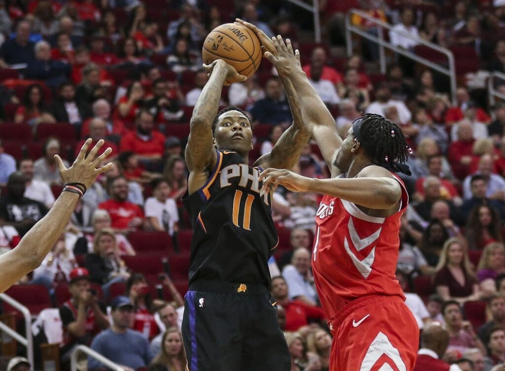 Apr 7, 2019; Houston, TX, USA; Phoenix Suns guard Jamal Crawford (11) shoots the ball against Houston Rockets forward Danuel House Jr. (4) during the third quarter at Toyota Center. Mandatory Credit: Troy Taormina-USA TODAY Sports