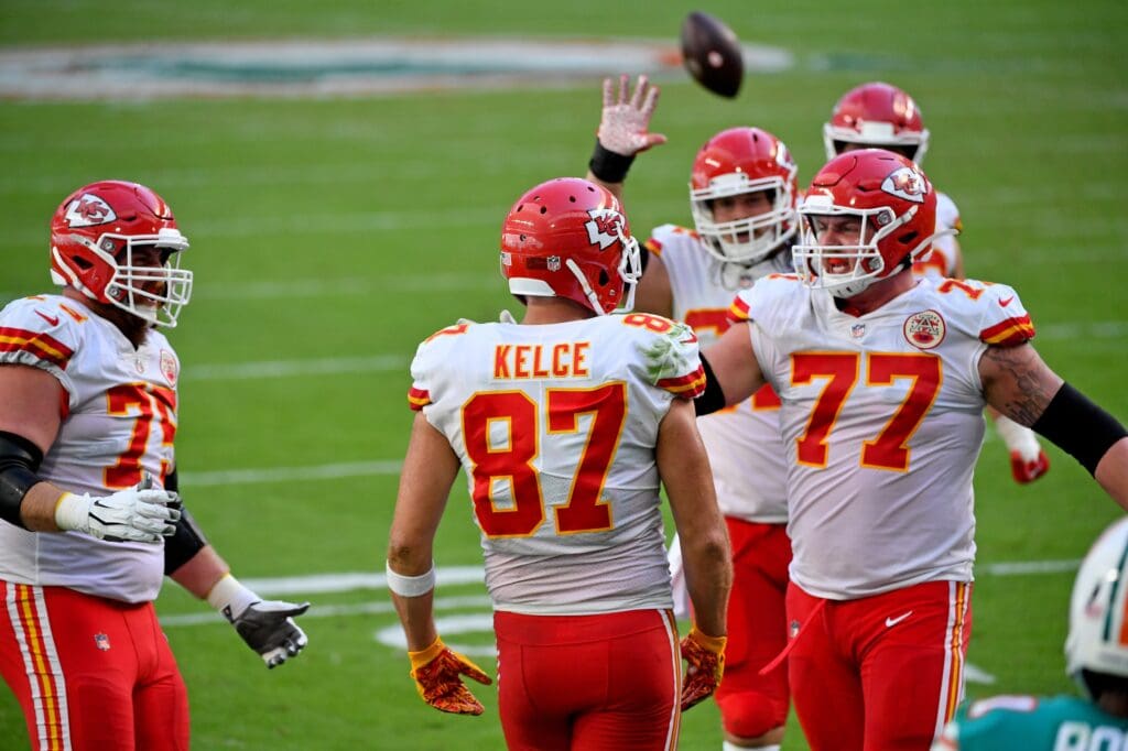 Dec 13, 2020; Miami Gardens, Florida, USA; Kansas City Chiefs tight end Travis Kelce (87) celebrates with teammates after scoring a touchdown against the Miami Dolphins during the first half at Hard Rock Stadium. Mandatory Credit: Jasen Vinlove-USA TODAY Sports