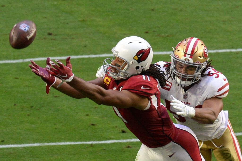 Dec 26, 2020; Glendale, Arizona, USA; Arizona Cardinals wide receiver Larry Fitzgerald (11) is unable to make a catch against San Francisco 49ers middle linebacker Fred Warner (54) during the first half at State Farm Stadium. Mandatory Credit: Joe Camporeale-USA TODAY Sports