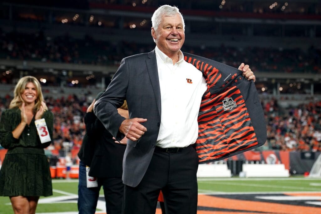 Former Cincinnati Bengals quarterback Ken Anderson displays the Ring of Honor insignia on the inside of his jacket during a halftime ceremony at halftime of a Week 4 NFL football game between the Jacksonville Jaguars and the Cincinnati Bengals