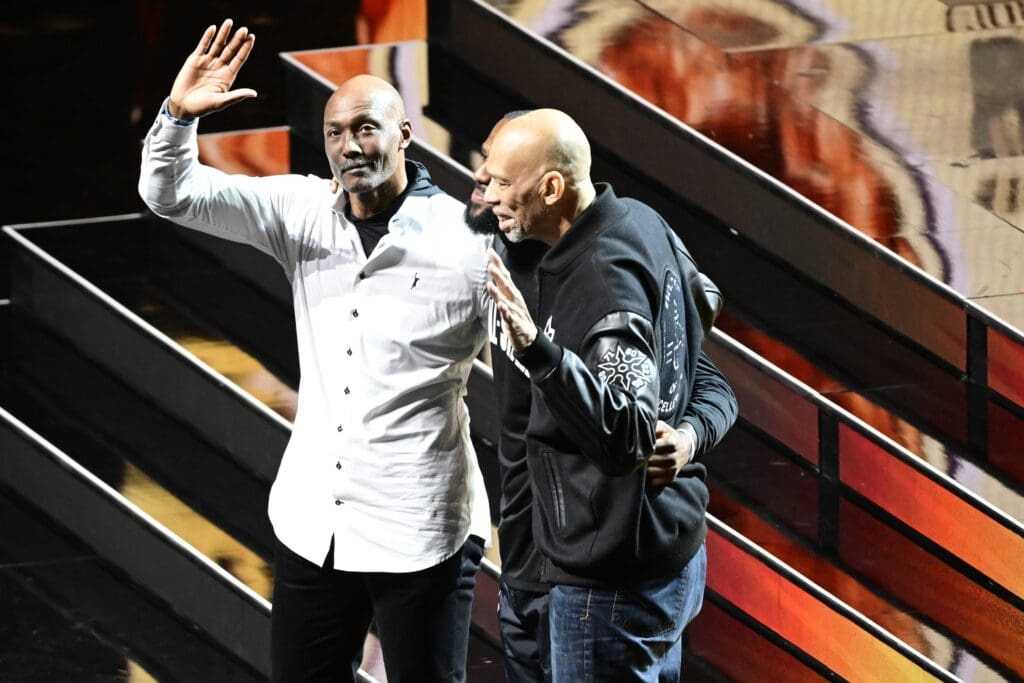 Feb 19, 2023; Salt Lake City, UT, USA; Kareem Abdul-Jabbar (right), Lebron James (center) and Karl Malone (left) acknowledge the crowd in the 2023 NBA All-Star Game at Vivint Arena. Mandatory Credit: Christopher Creveling-USA TODAY Sports