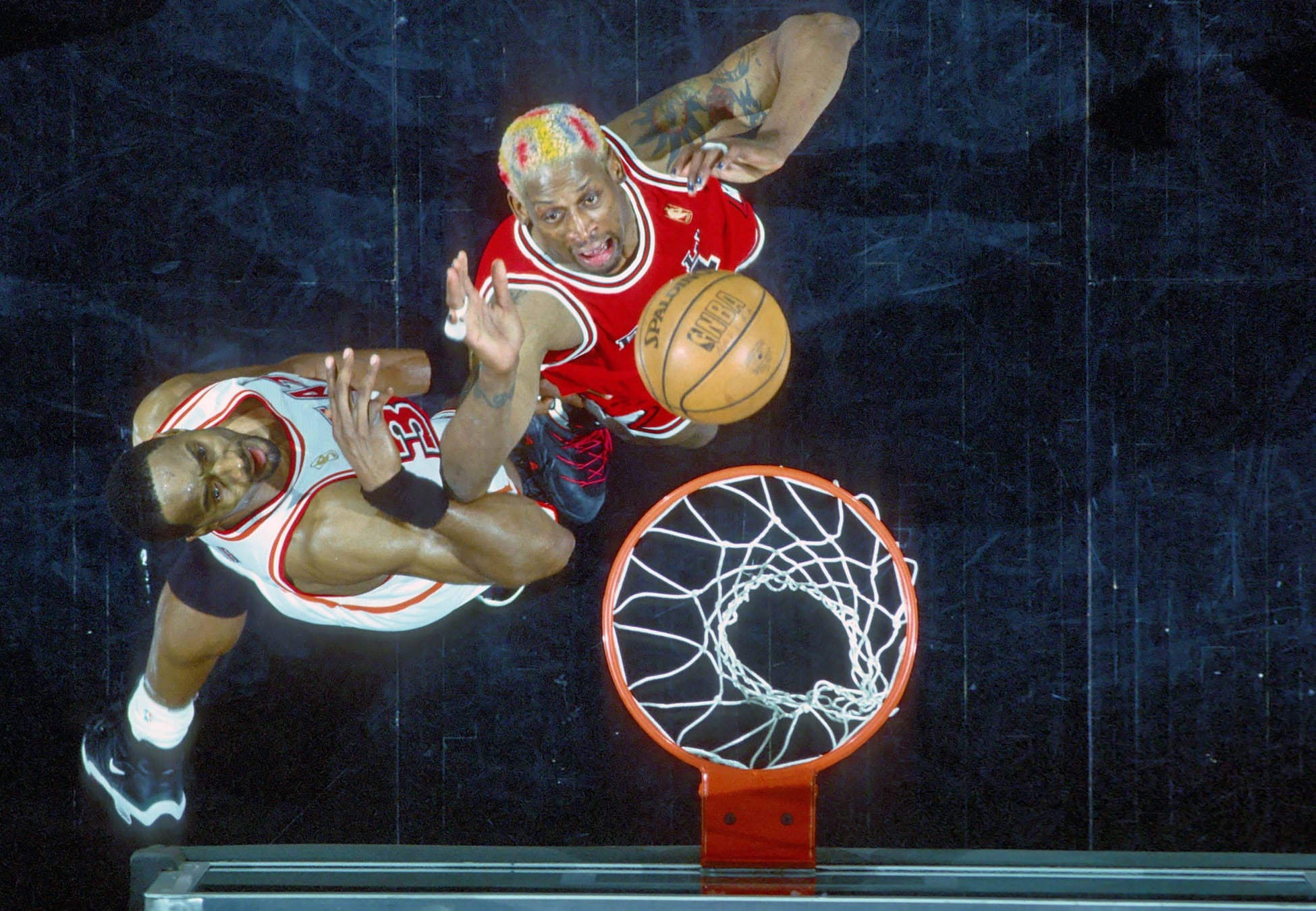 Unknown Date 1997; Miami, FL, USA; FILE PHOTO; Chicago Bulls forward #91 DENNIS RODMAN looks to rebound against Miami Heat center ALONZO MOURNING at the Miami Arena during the 1996-97 season. Mandatory Credit: Photo By USA TODAY Sports (c) Copyright USA TODAY Sports