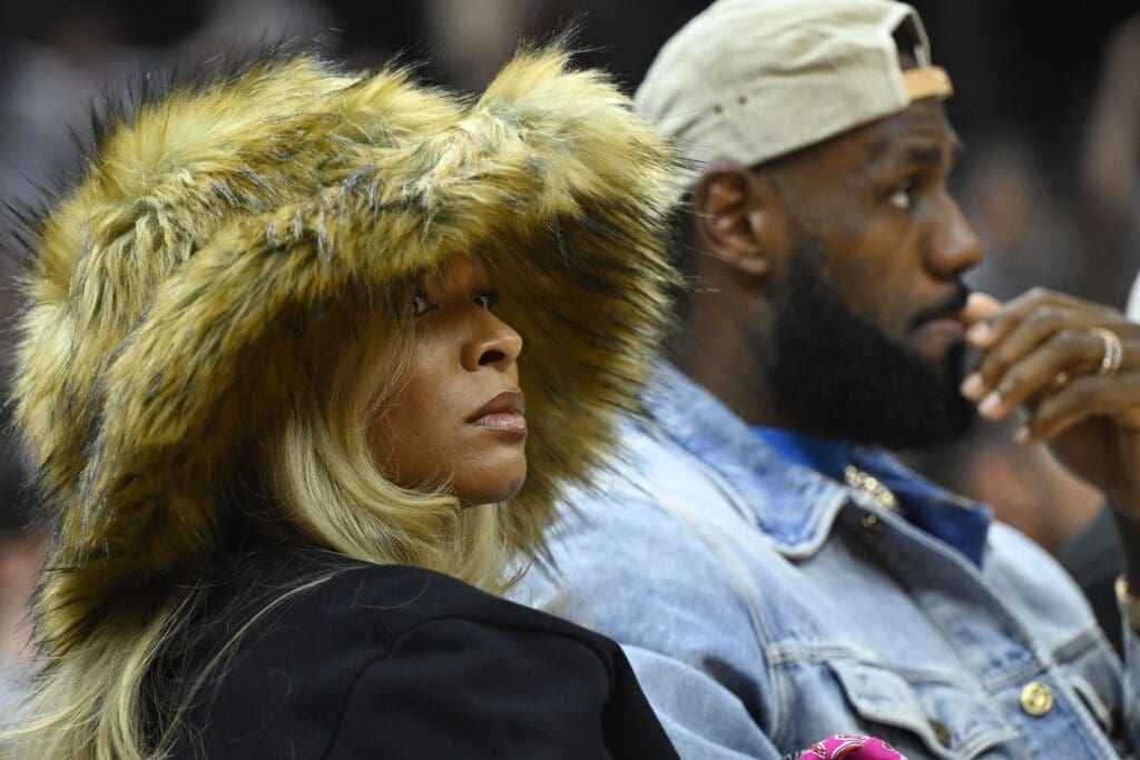 May 13, 2024; Cleveland, Ohio, USA; Los Angeles Lakers forward LeBron James and his wife Savannah James watch the game in the second quarter of game four of the second round for the 2024 NBA playoffs between the Cleveland Cavaliers and the Boston Celtics at Rocket Mortgage FieldHouse. Mandatory Credit: David Richard-USA TODAY Sports