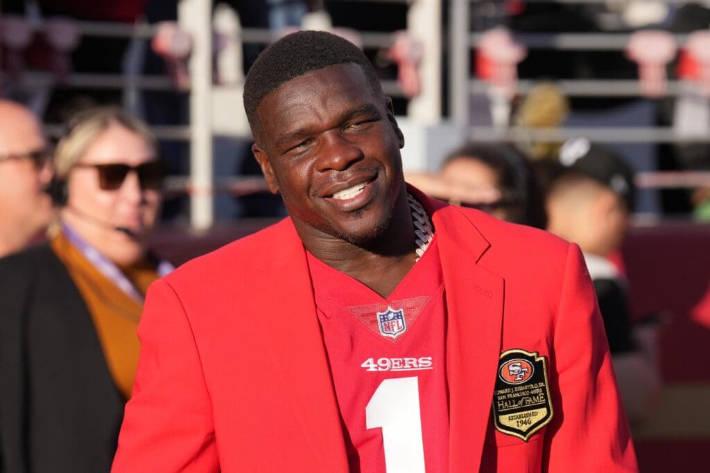 Sep 9, 2024; Santa Clara, California, USA; San Francisco 49ers former running back Frank Gore stands on the sideline during the second quarter against the New York Jets at Levi's Stadium. Mandatory Credit: Darren Yamashita-Imagn Images