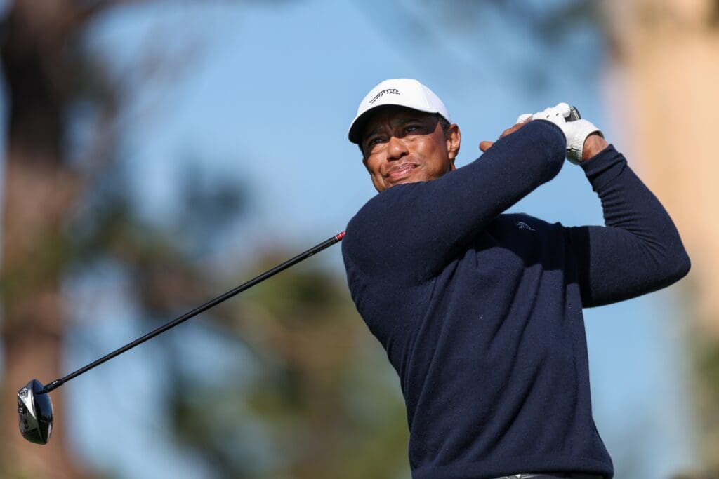 Dec 21, 2024; Orlando, Florida, [USA]; Tiger Woods tees off on the fifth hole during the PNC Championship at The Ritz-Carlton Golf Club. Mandatory Credit: Nathan Ray Seebeck-Imagn Images