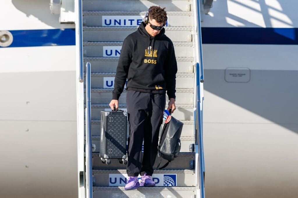 Feb 2, 2025; Kenner, LA, USA; Kansas City Chiefs quarterback Patrick Mahomes (15) exits the plane after arriving at Louis Armstrong New Orleans International Airport. Mandatory Credit: Stephen Lew-Imagn Images