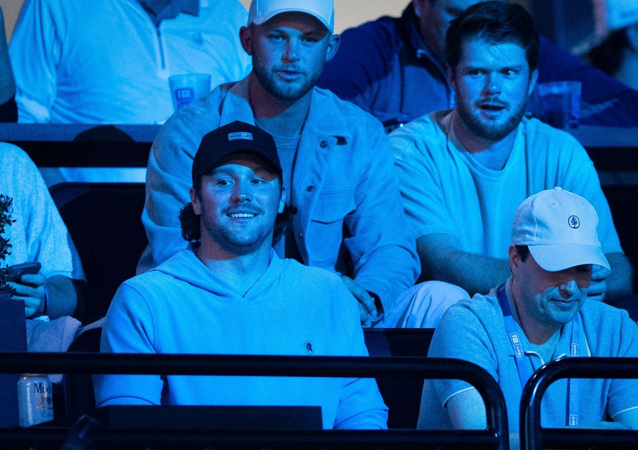 Buffalo Bills quarterback Josh Allen, bottom left, and Minnesota Vikings quarterback Sam Darnold, top right, attend the TGL match between Jupiter Links GC and Atlanta Drive GC at SoFi Center on March 4, 2025, in Palm Beach Gardens, Florida.