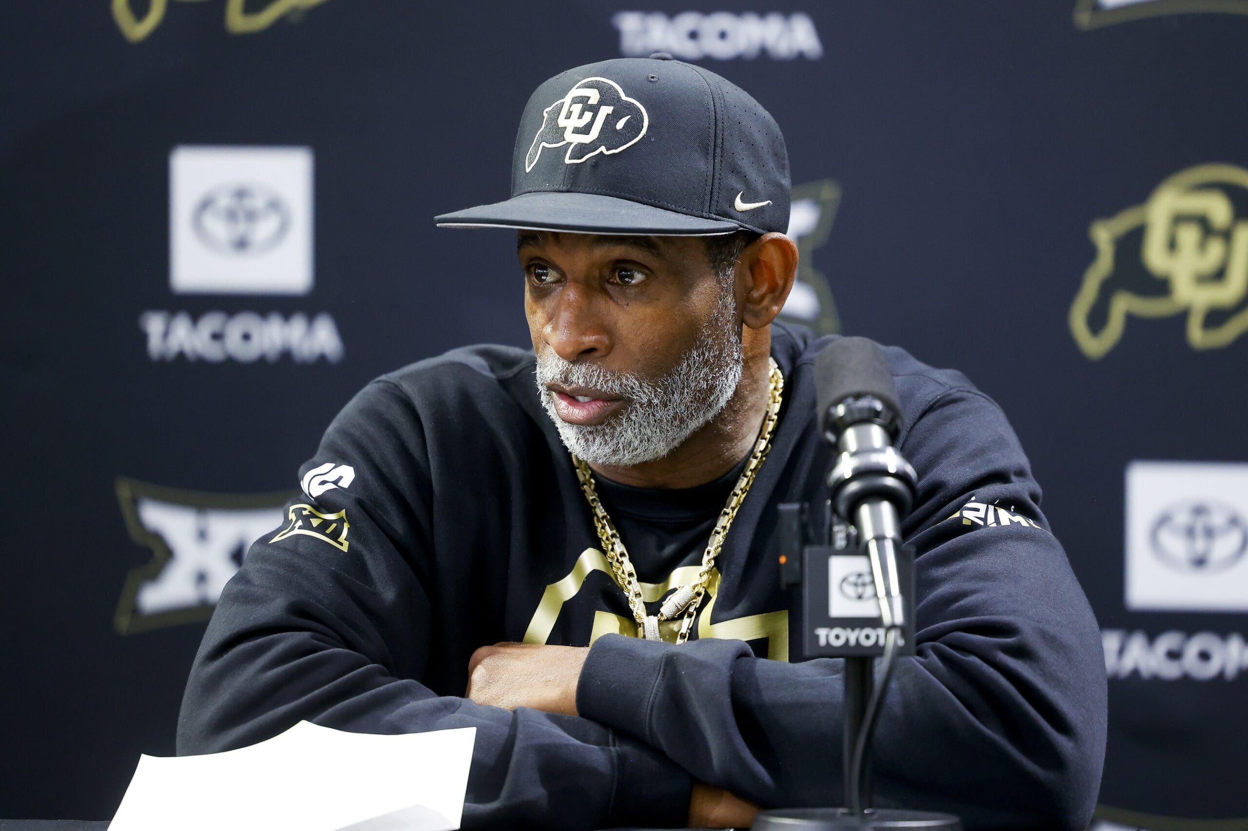 Apr 4, 2025; Boulder, CO, USA; Colorado Buffaloes head coach Deion Sanders speaks to the media at the University of Colorado NFL Showcase at the CU Indoor Practice Facility. Mandatory Credit: Michael Ciaglo-Imagn Images