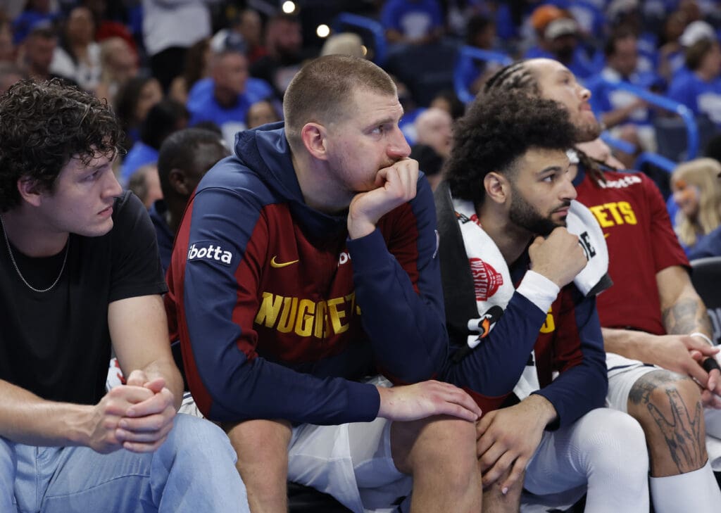 May 18, 2025; Oklahoma City, Oklahoma, USA; Denver Nuggets center Nikola Jokic (15) watches the game from the bench in the fourth quarter against the Oklahoma City Thunder in game seven of the second round for the 2025 NBA Playoffs at Paycom Center.