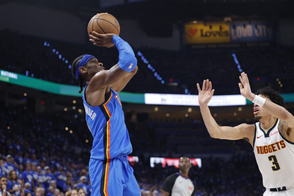 May 18, 2025; Oklahoma City, Oklahoma, USA; Oklahoma City Thunder guard Shai Gilgeous-Alexander (2) shoots as Denver Nuggets guard Julian Strawther (3) defends in the second half of game seven of the second round for the 2025 NBA Playoffs at Paycom Center.