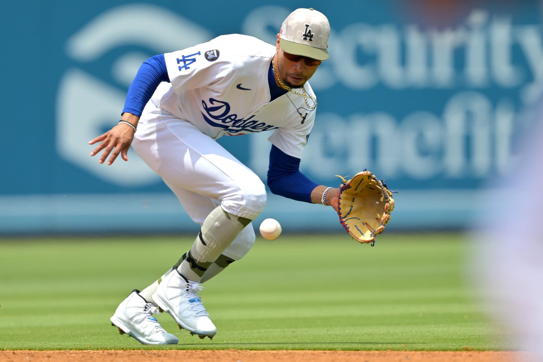 May 18, 2025; Los Angeles, California, USA; Los Angeles Dodgers shortstop Mookie Betts (50) makes a play and throws Los Angeles Angels third baseman Luis Rengifo (2) out at first in the second inning at Dodger Stadium. Mandatory Credit: Jayne Kamin-Oncea-Imagn Images