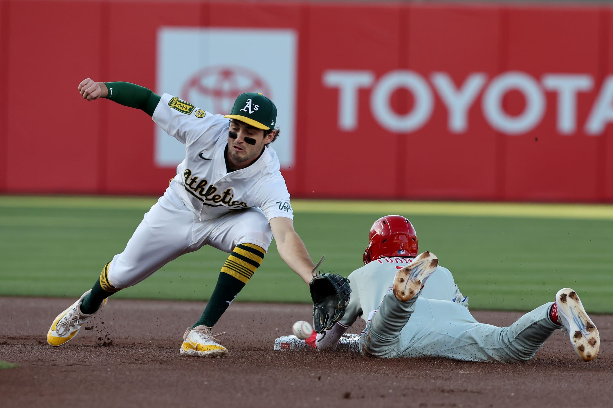 May 24, 2025; West Sacramento, California, USA; Philadelphia Phillies shortstop Trea Turner (7) slides safely into second base against the Athletics during the first inning at Sutter Health Park. Mandatory Credit: Dennis Lee-Imagn Images